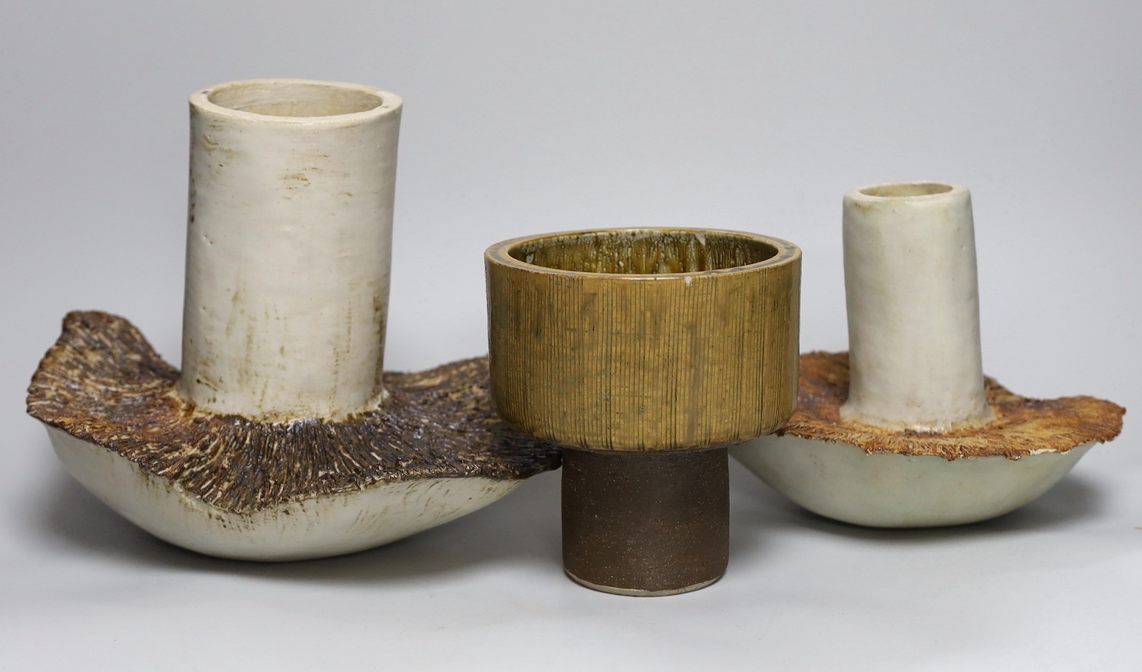 Ruth Sulke - two studio glazed stoneware ‘mushroom’ vases, together with a small studio pottery jardiniere, tallest 21cm
